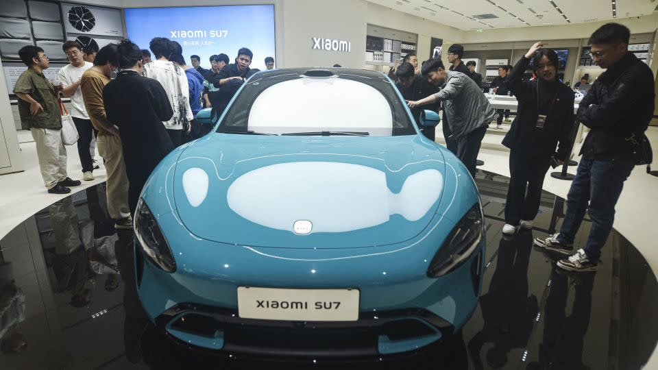 Chinese smartphone maker Xiaomi's first electric car, Xiaomi SU7 model, is seen at a shop in Hangzhou, in eastern China's Zhejiang province on March 25, 2024. - Stringer/AFP/Getty Images
