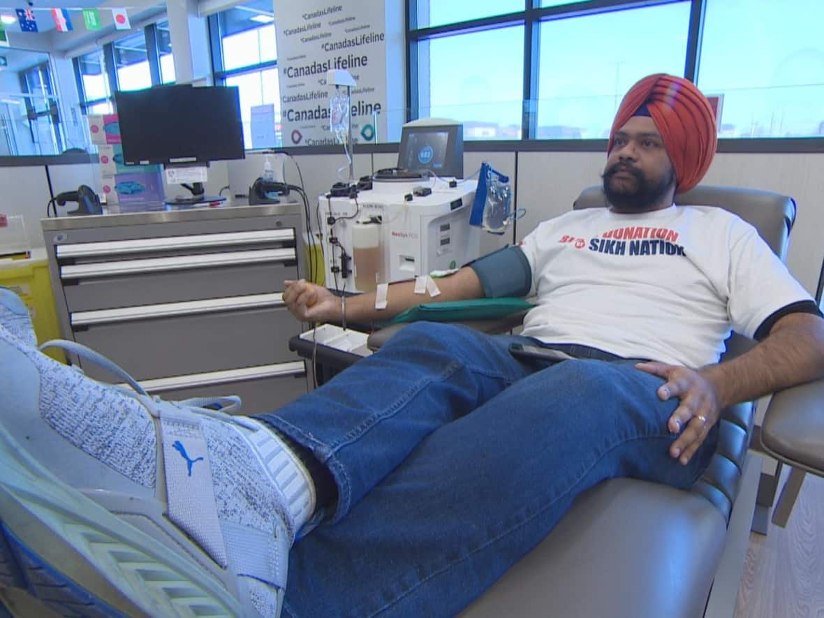 Gurinderpreet Mann is a regular plasma donor at the Brampton Plasma Centre, which opened in summer of 2022. He says it's important to give back to his community and save lives, in line with the teachings of the founder of Sikhism, Guru Nanak. (Spencer Gallichan-Lowe/CBC - image credit)