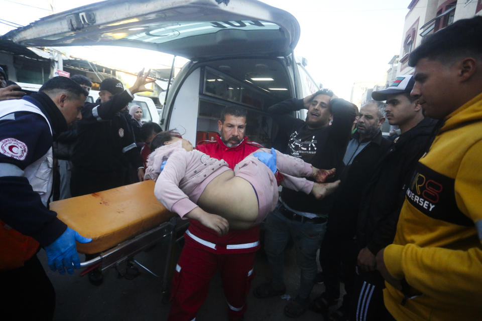Palestinians wounded in an Israeli strike are brought to a hospital in Rafah, Gaza Strip, Sunday, Feb. 11, 2024. (AP Photo/Hatem Ali)