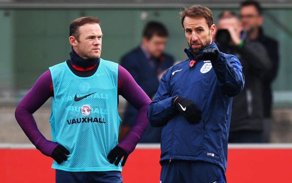 Gareth Southgate interim manager of England in discussion with Wayne Rooney during an England training session at St Georges Park on November 8, 2016 in Burton-upon-Trent, England. England are due to face Scotland in a World Cup qualifier on November 11 at Wembley