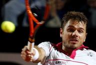 Stan Wawrinka of Switzerland returns the ball to Rafael Nadal of Spain during their men's quarter-final match at the Rome Open tennis tournament in Rome, Italy, May 15, 2015. REUTERS/Stefano Rellandini