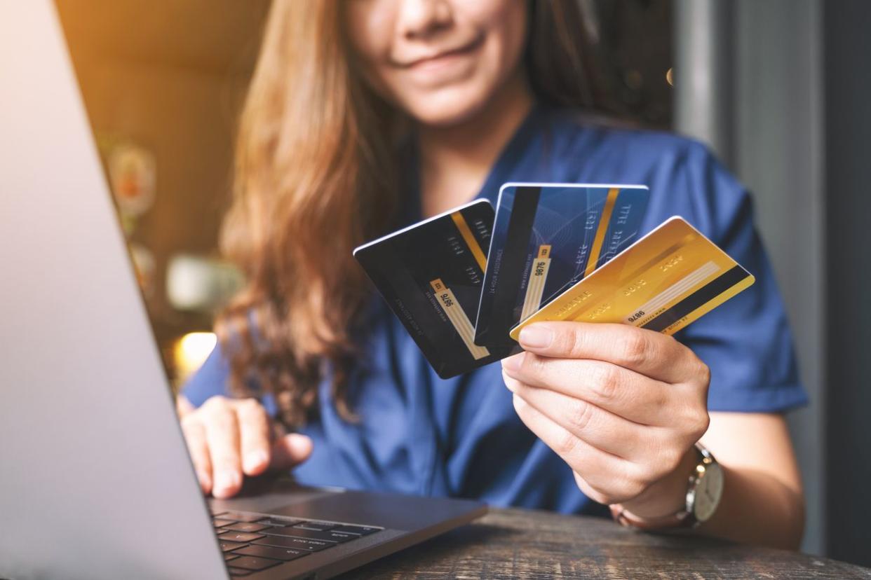 woman holding credit cards