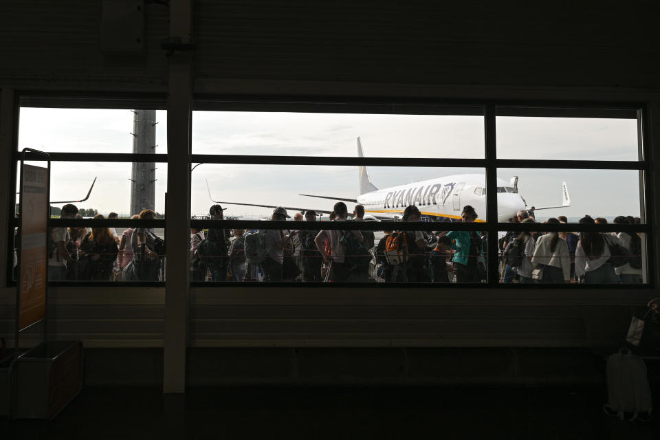 Passengers line up to board a Ryanair flight at Paris-Beauvais airport, June 20, 2023, in Tille, France. / Credit: Artur Widak/NurPhoto/Getty