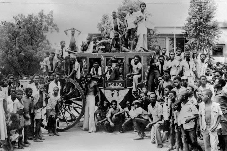 People surround the coach of former emperor Bokassa, on October 1, 1979 in Bangui, Central African Republic, after he was overthrown by former president David Dacko on September 20, 1979