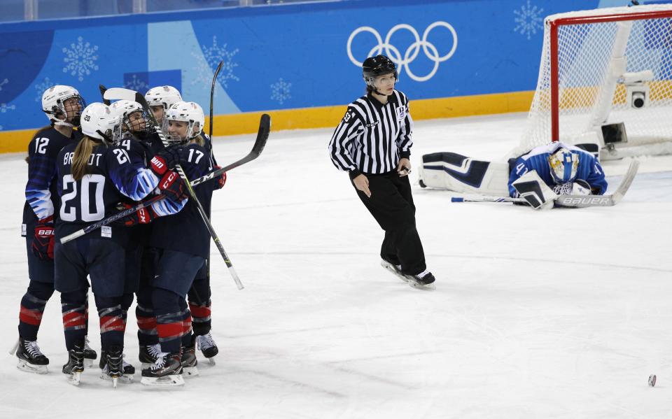 <p>Jocelyne Lamoureux of U.S. (17) celebrates with teammates after scoring her goal. REUTERS/Brian Snyder </p>