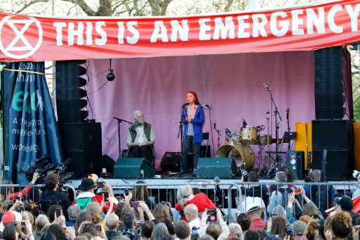 Swedish teenage climate change activist Greta(C) speaks at the Extinction Rebellion group's environmental protest camp in London saying "humanity is now standing at a crossroads"