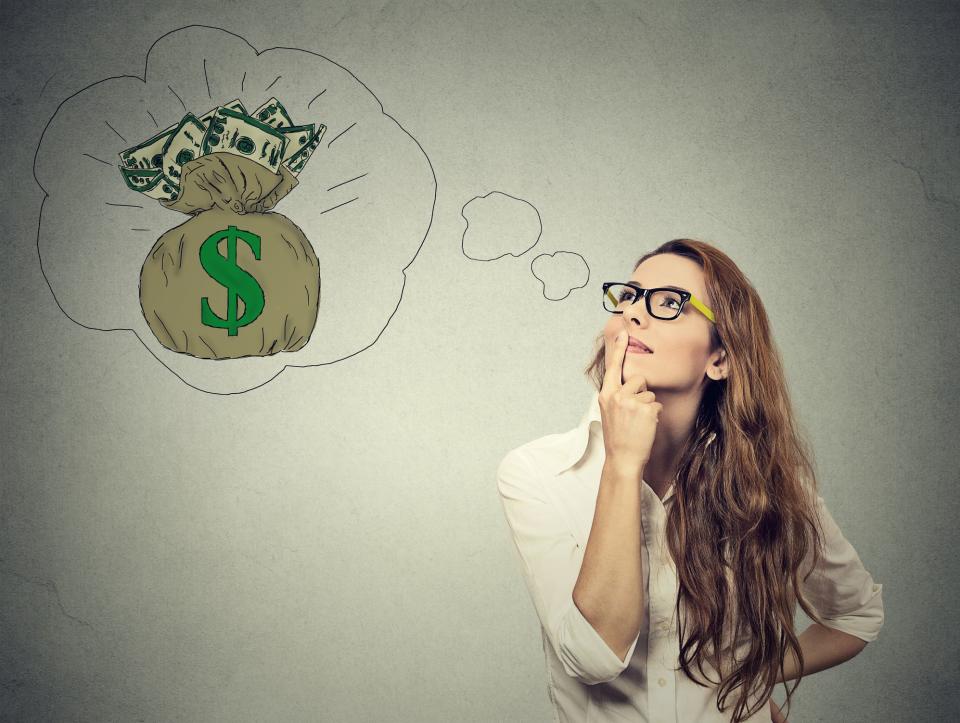 A woman thinking, with an illustrated thought bubble containing a bag of money above her head