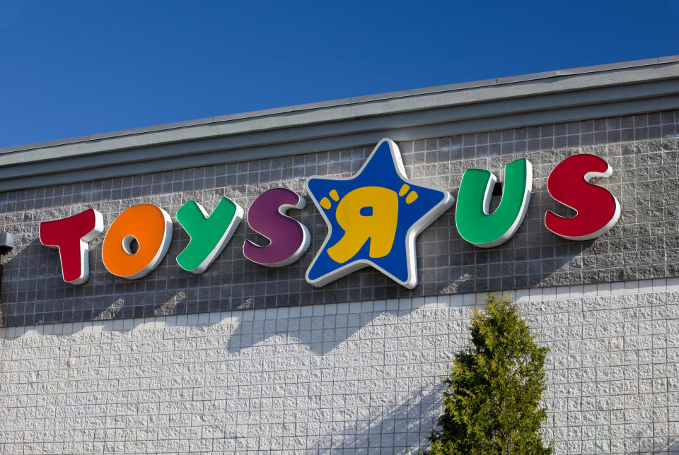 The image shows the Toys "R" Us logo on the outside of a building