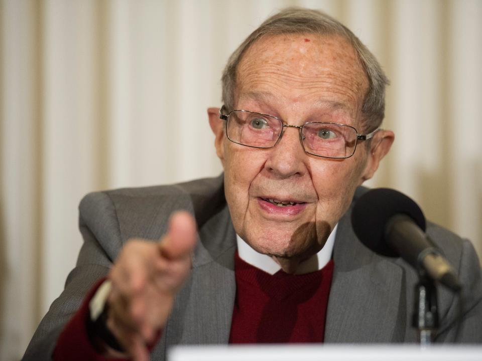 Former Secretary of Defense William Perry speaks into a microphone