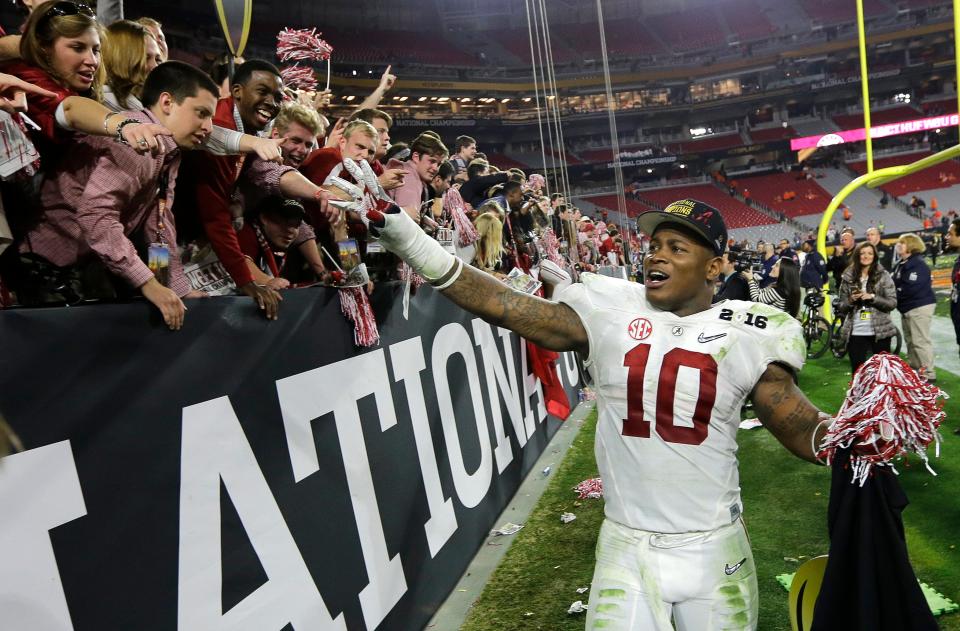 Alabama's Reuben Foster celebrates with fans after the College Football Playoff championship game against Clemson, Monday, Jan. 11, 2016, in Glendale, Ariz. Alabama won 45-40.