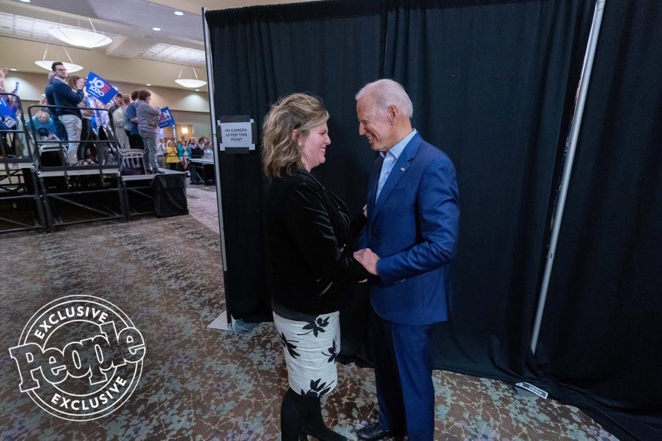 Biden speaks with Ellen Goodmann Miller before taking the stage in Dubuque, Iowa, on April 30, 2019, at the Grand River Center.