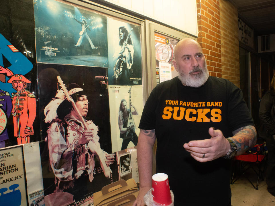 Owner Kevin Sandridge speaks to a reporter during Record Store Day at Positively Records in Levittown. The store opened from midnight to 2 a.m. for the day that celebrates independent record shops, vinyl and music. Several artist put out limited edition vinyls for the day.