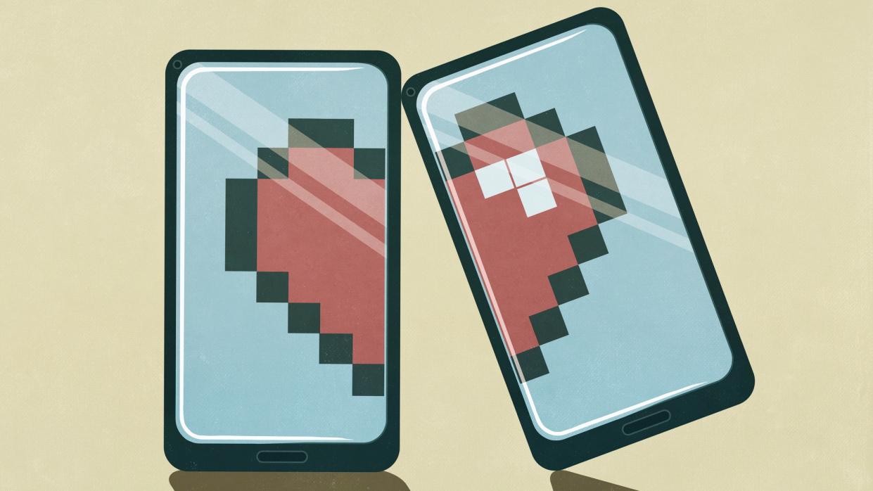  An illustration of two halves of a heart split across two smartphones to show heartbreak. 