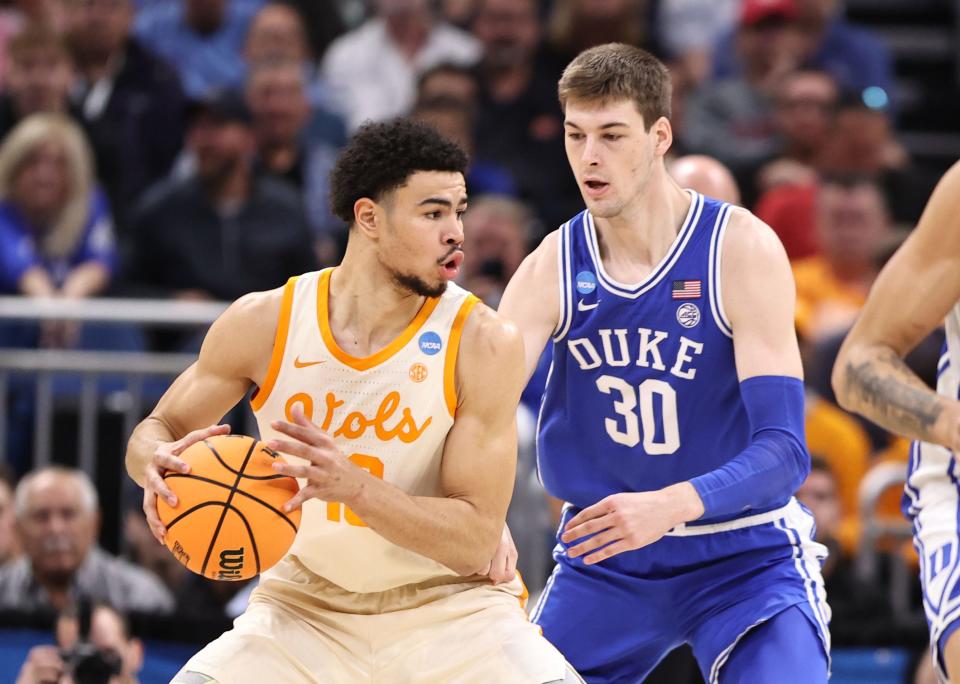 Mar 18, 2023; Orlando, FL, USA;  Tennessee Volunteers forward Olivier Nkamhoua (13) is defended by Duke Blue Devils center Kyle Filipowski (30) during the first half in the second round of the 2023 NCAA Tournament at Legacy Arena. Mandatory Credit: Matt Pendleton-USA TODAY Sports