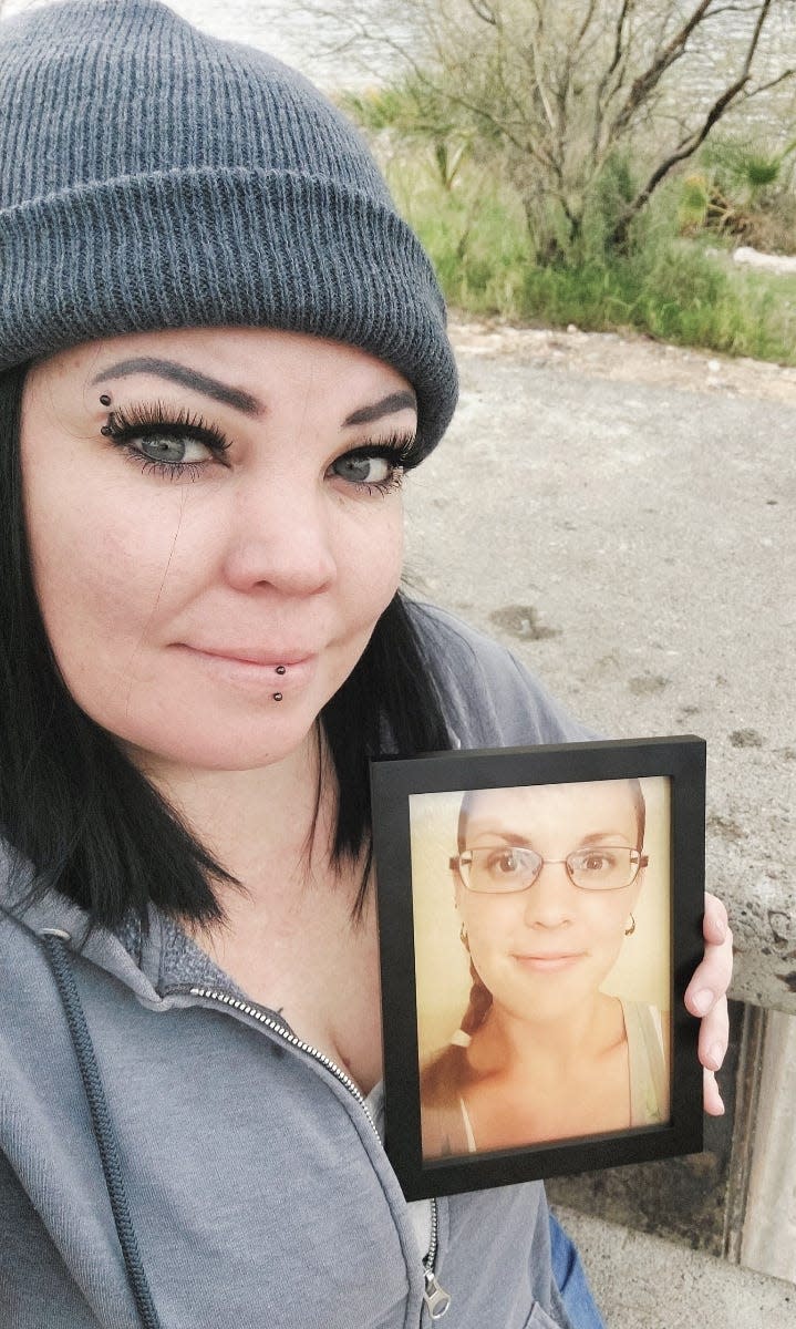 Sheila Gallaway holds a photograph of her sister, Heather Hann, who died in May 2022 from alcoholic cirrhosis, a liver disease.