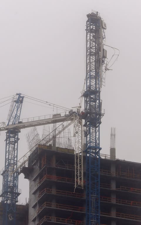 A partially collapsed construction tower crane after the full effects of Hurricane Irma struck in Miami, Florida - Credit: EPA