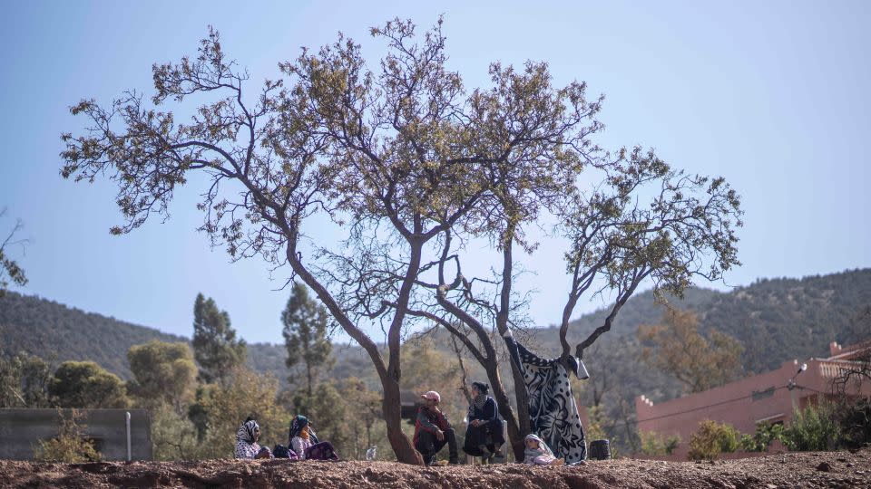 People take shelter under trees after their home was damaged by the earthquake, in Ouargane village, near Marrakech. - Mosa'ab Elshamy/AP