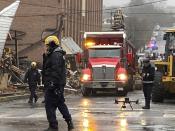 Emergency personnel work at the site of a deadly explosion at a chocolate factory in West Reading, Pa., Saturday, March 25, 2023. (AP Photo/Michael Rubinkam)