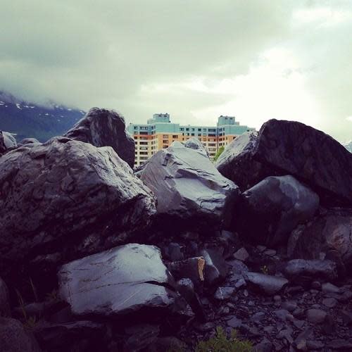 begich towers peaking out between the mountain top