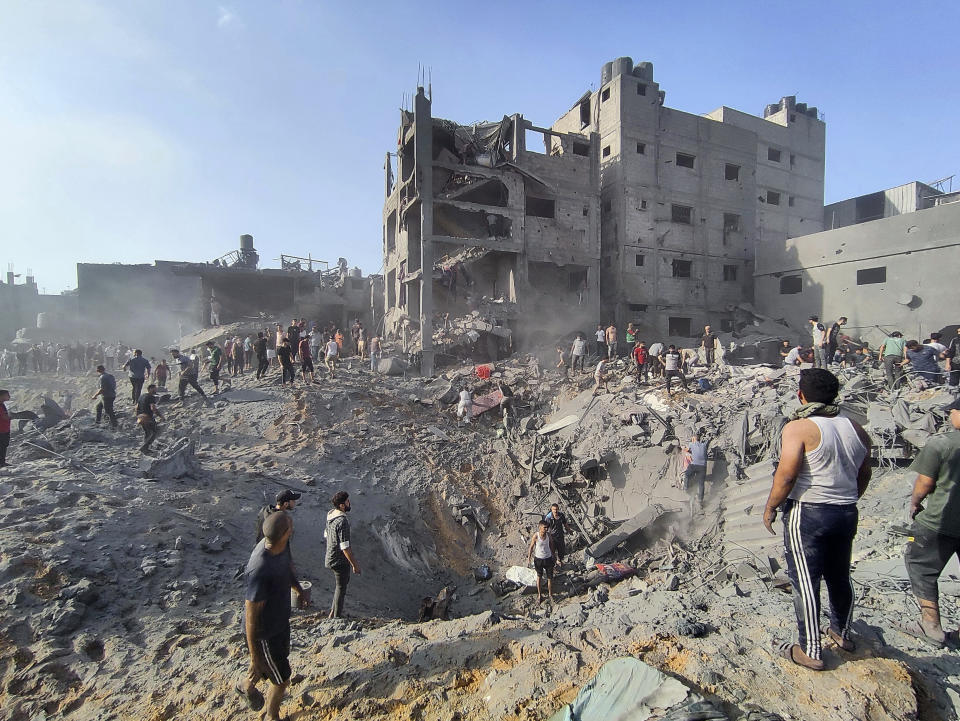 FILE - Palestinians inspect the damage of buildings destroyed by Israeli airstrikes on Jabaliya refugee camp on the outskirts of Gaza City on Oct. 31, 2023. Weeks after ordering northern Gaza's 1.1 million inhabitants to evacuate south, the Israeli army is intensifying its bombing of the area that stretches to the wetlands of Wadi Gaza. Israeli soldiers are also battling Hamas militants just north of Gaza City. It's the start of what officials expect to be a long and bloody invasion that has already pinned down hundreds of thousands of Palestinians who remain in the north. (AP Photo/Abdul Qader Sabbah, File)