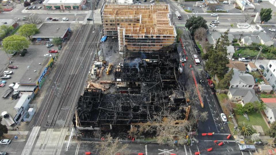 An aerial view from a drone shows the destruction to a five-story building under construction on 19th and X streets in Sacramento following a fire on Tuesday, March, 26, 2024. The three-alarm fire destroyed one of two affordable apartment complexes being built in the Broadway corridor.