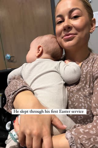 <p>Shawn Johnson/Instagram</p> Shawn Johnson East smiles holding son Barrett 'Bear' at church