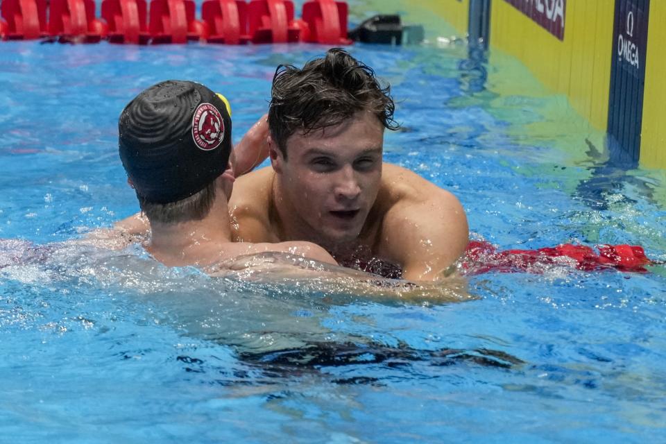 Luke Whitlock and Robert Finke embrace after the Men's 800 freestyle finals Tuesday, June 18, 2024, at the US Swimming Olympic Trials in Indianapolis. (AP Photo/Michael Conroy)