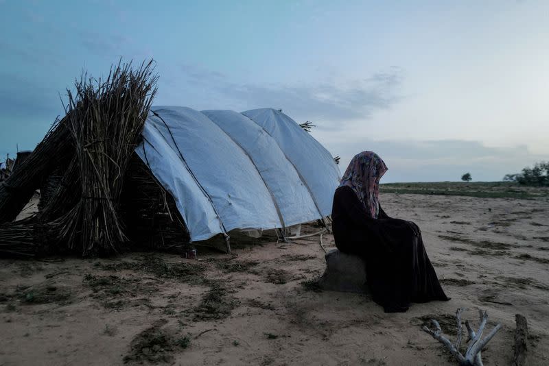 FILE PHOTO: A 15-year-old victim of sexual violence in El Geneina, West Darfur, is seen outside a makeshift shelter in Adre, Chad