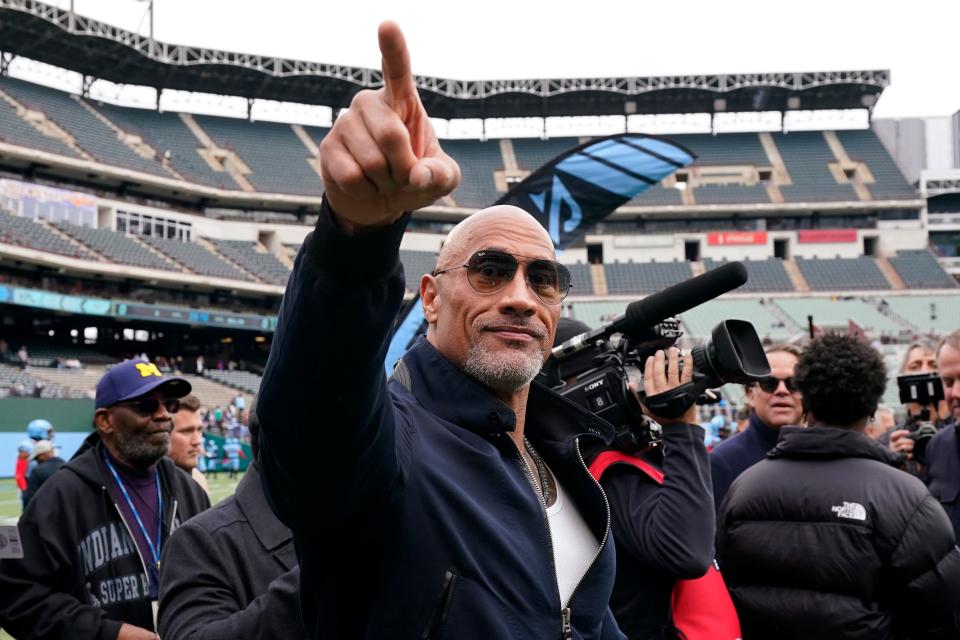 Dwayne Johnson gestures to the crowd before the game between the Arlington Renegades and the Vegas Vipers at Choctaw Stadium on February 18, 2023 in Arlington, Texas.
