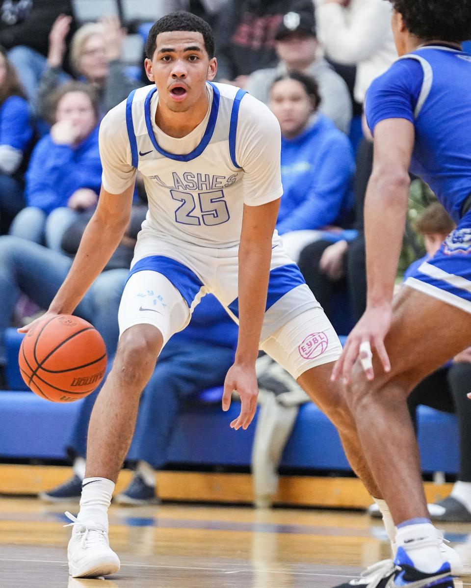 Franklin Central Flashes EJ Hazelett III (25) dribbles the ball Thursday, Feb. 1, 2024, during the game at Franklin Central High School in Indianapolis. The Hamilton Southeastern Royals defeated the Franklin Central Flashes.