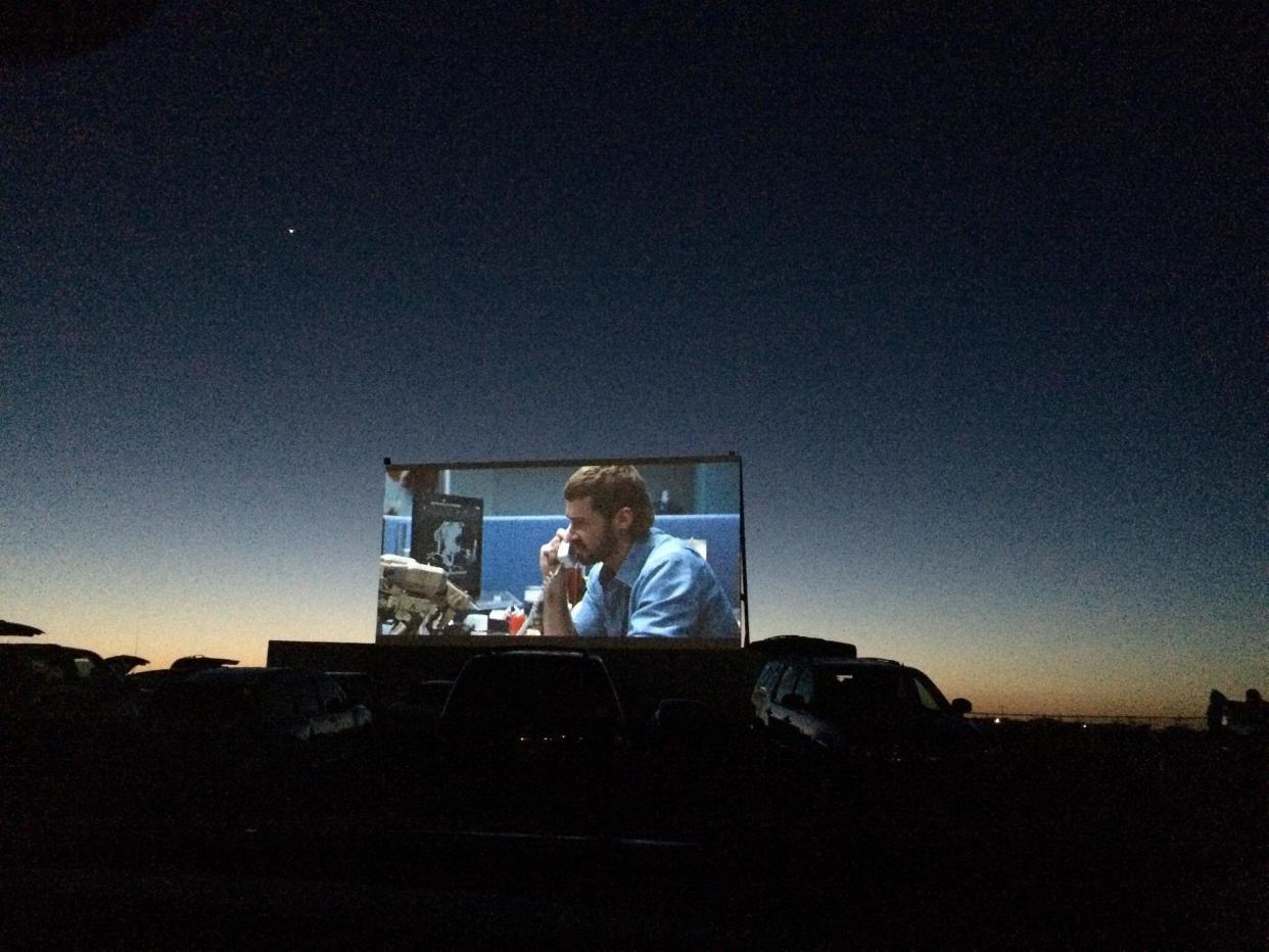 Screen with film playing in Big Sky Drive-In, Midland, Texas.
