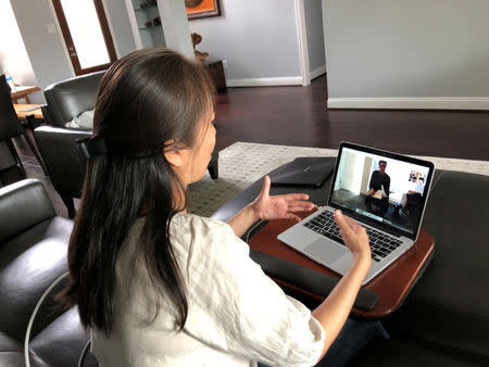 Vietnamese dissident Nguyen Ngoc Nhu Quynh, who goes by the pen name Mother Mushroom, speaks with a reporter during a video conference on her laptop computer, in Houston, Texas, October 19, 2018. Courtesy of Chi Dang/Handout via REUTERS