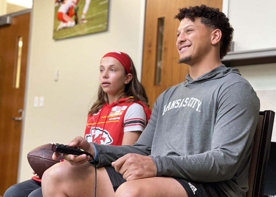 Myka Eilers and Kansas City Chiefs quarterback Patrick Mahomes review game footage together in Kansas City, Missouri in 2022. (Courtesy Make-A-Wish Foundation)