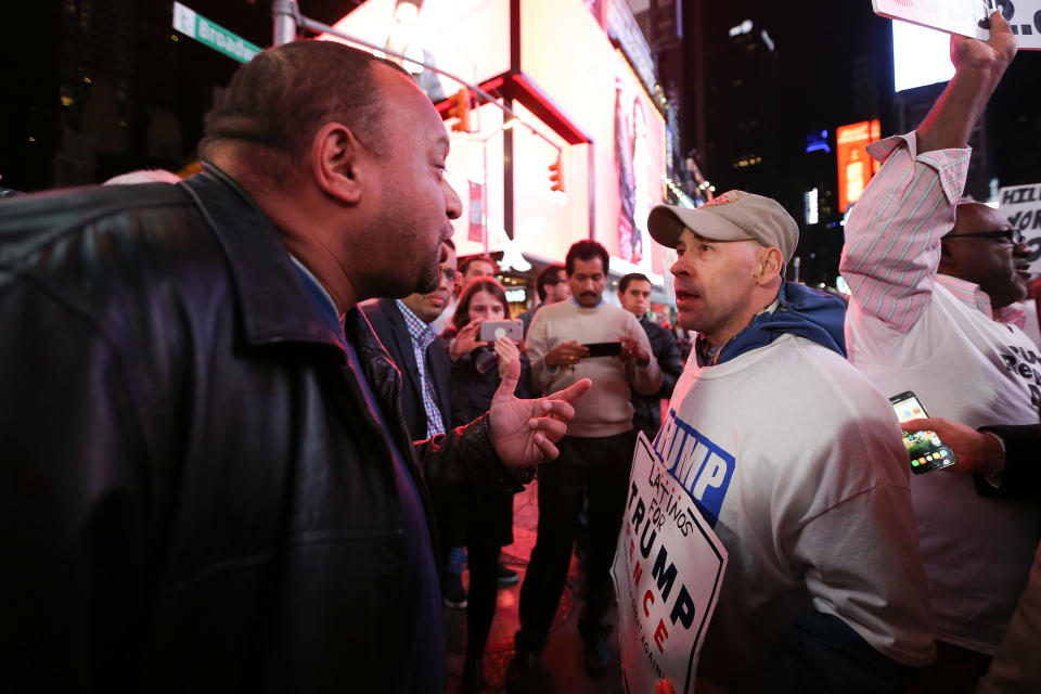 Donald Trump supporters and protestors argue in Times Square as they await election results &nbsp;in New York, on Nov. 8