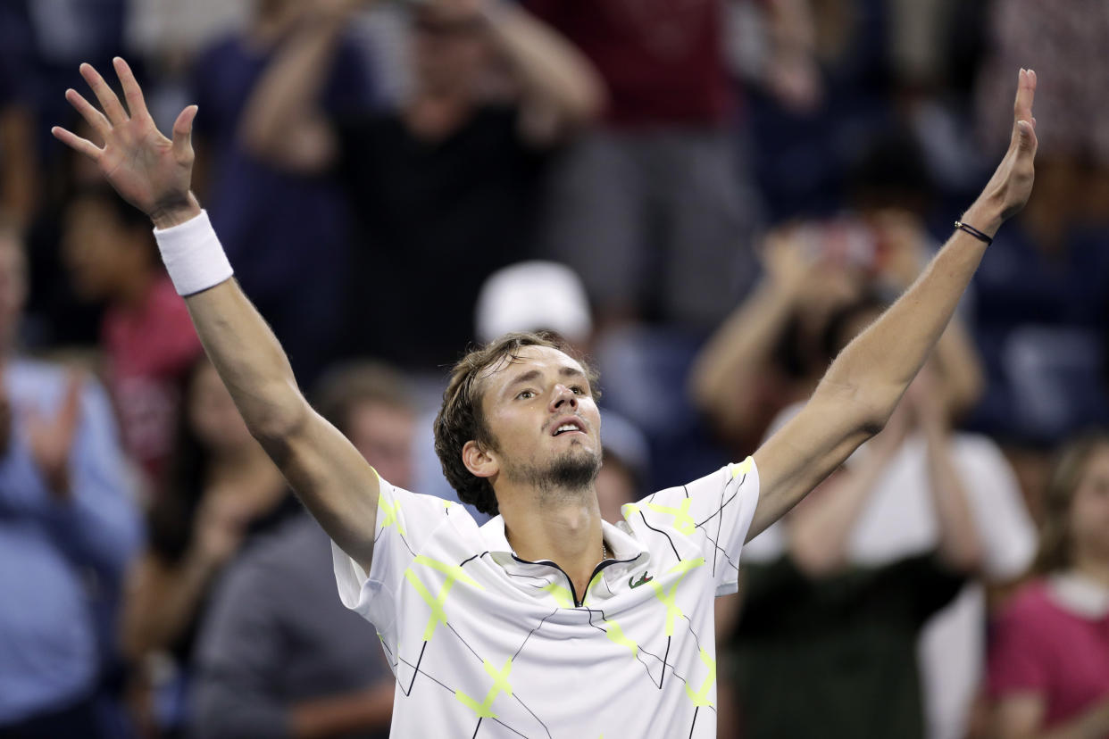 Daniil Medvedev, of Russia, raises his arms after defeating Feliciano Lopez, of Spain, during the third round of the U.S. Open tennis tournament early Saturday, Aug. 31, 2019, in New York. (AP Photo/Adam Hunger)