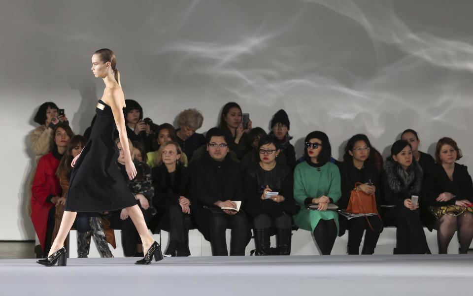 A model wears a creation for Jil Sander women's Fall-Winter 2013-14 collection, part of the Milan Fashion Week, unveiled in Milan, Italy, Saturday, Feb. 23, 2013. (AP Photo/Antonio Calanni)