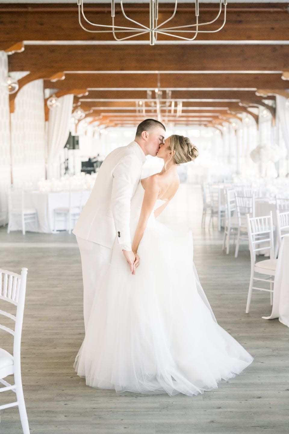 a bride and a groom kiss