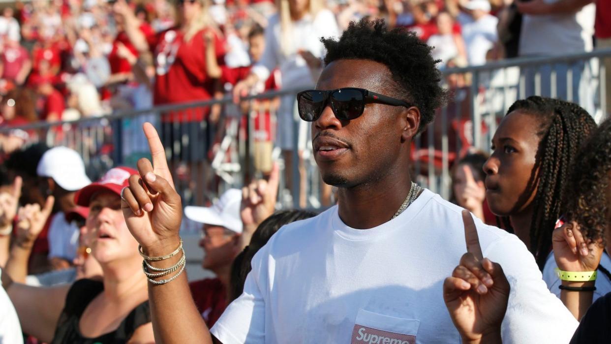 Mandatory Credit: Photo by Sue Ogrocki/AP/Shutterstock (10404200l)Buddy Hield, a Bahamian professional basketball player and a former University of Oklahoma basketball player, stands for the Alma Mater before an NCAA college football game between South Dakota and Oklahoma, in Norman, OklaSouth Dakota Oklahoma Football, Norman, USA - 07 Sep 2019.