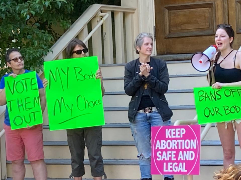 Taylor West (right) of New York City speaks to a crowd of over 100 people on Friday in front of Provincetown Town Hall following the Supreme Court ruling that there is no constitutional right to abortion.