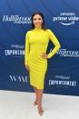 <p>Neon is one of the more intimidating '80s trends, but Eva Longoria pulls it off thanks to the length of this dress and simple accessories. </p>