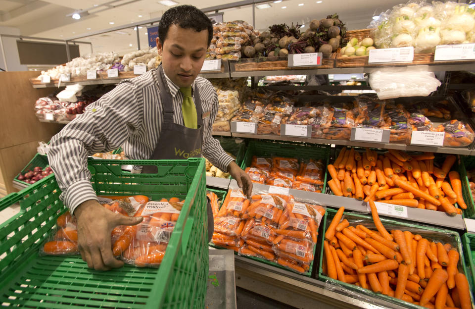 food waste A worker stocks produce shelves in the Canary Wharf store of Waitrose in London January 23, 2013. Waitrose outperformed bigger rivals Tesco, Sainsbury's and Morrisons at Christmas and market research group Kantar Worldpanel said last week its market share in the festive trading period was 4.9 percent - a new high. Picture taken January 23, 2013.  REUTERS/Neil Hall (BRITAIN - Tags: BUSINESS FOOD)