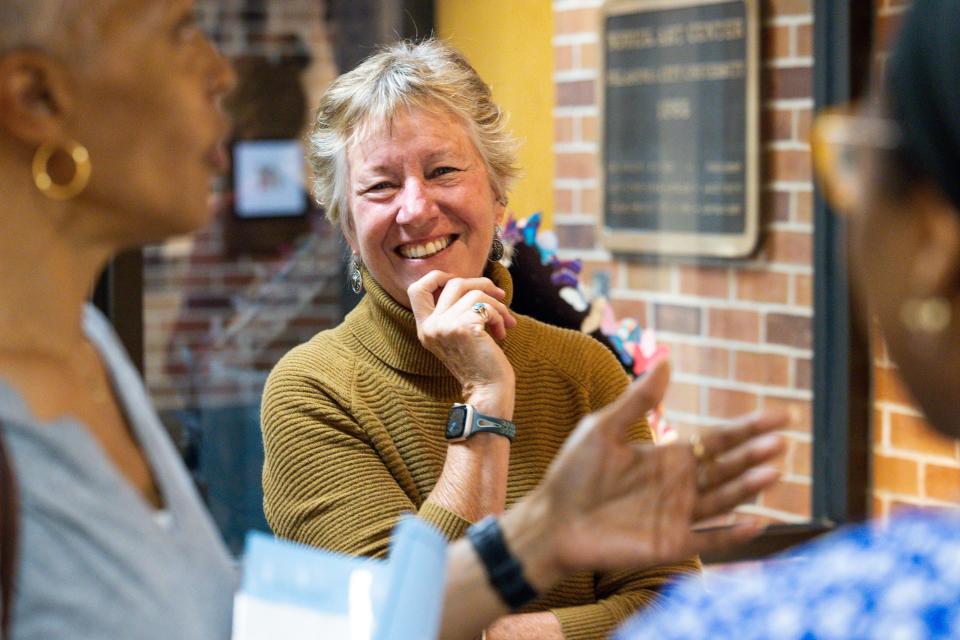 Ellen Stackable, founder of Oklahoma-based Poetic Justice, talks with visitors at the "Poetic Justice: Voices on the Inside" exhibit at  the Norick Art Center, 1608 NW 26, on the Oklahoma City University campus.