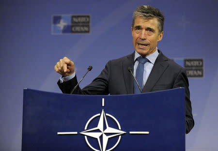NATO Secretary General Anders Fogh Rasmussen addresses a news conference during a NATO defence ministers meeting at the Alliance headquarters in Brussels June 4, 2014. REUTERS/Laurent Dubrule