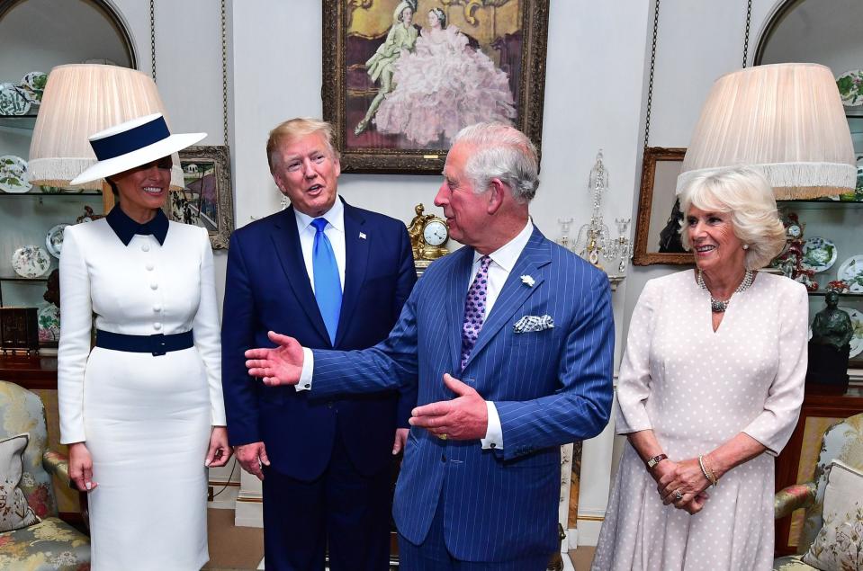 President Donald Trump and first lady Melania Trump pose with their hosts Prince Charles, Prince of Wales, and his wife, Camilla, Duchess of Cornwall, before taking tea at Clarence House in on June 3, 2019, on the first day of the the Trumps' three-day State Visit to the UK.