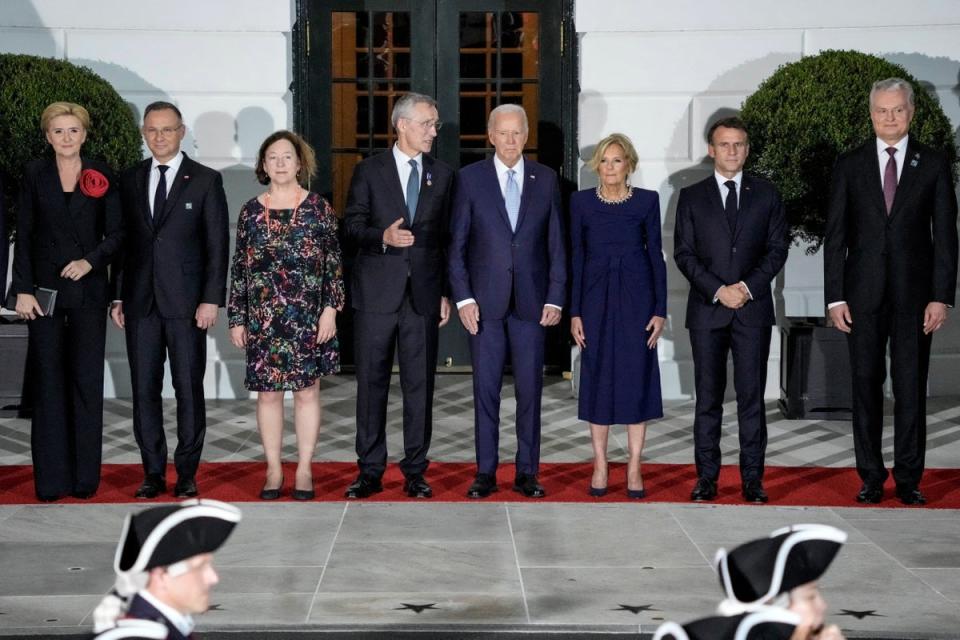 US president Joe Biden and first lady Jill Biden pose for a picture with Nato allies and partners ahead of a dinner at the White House in Washington (Reuters)