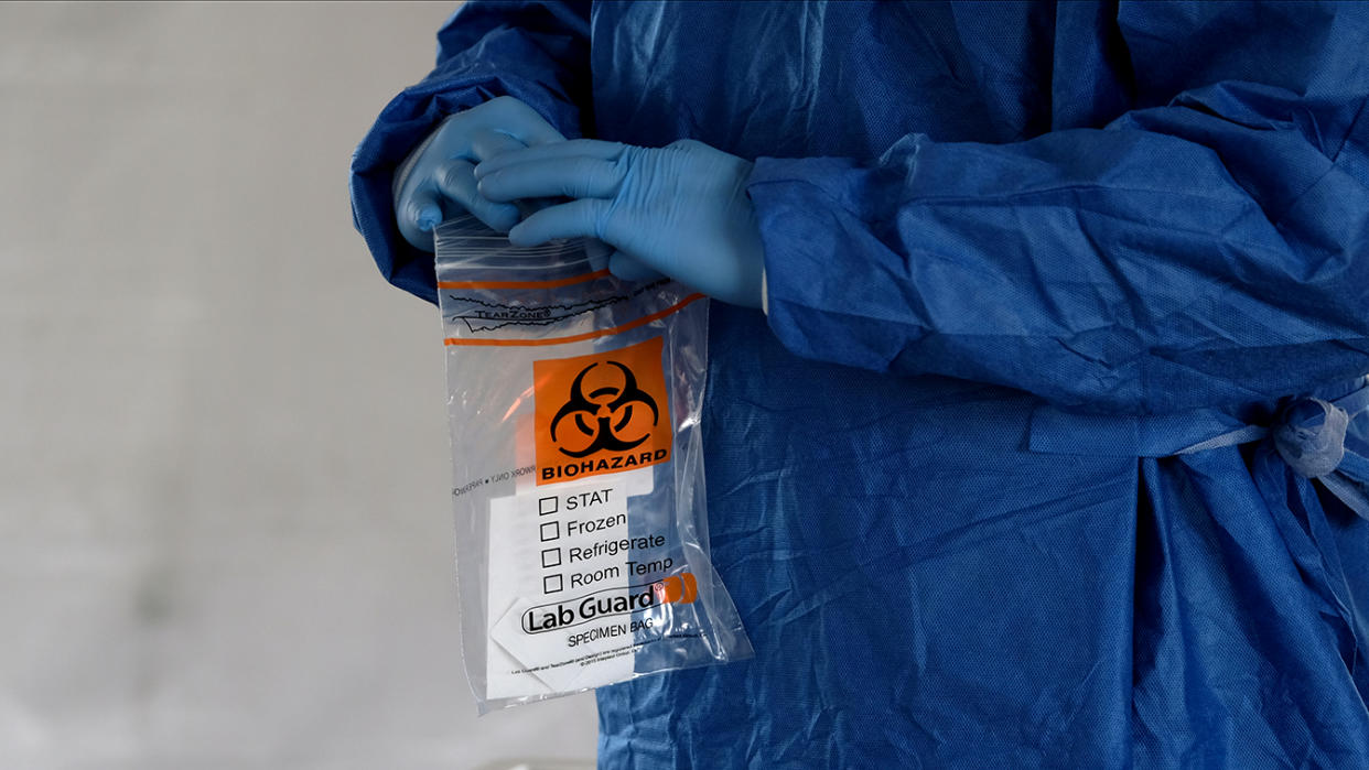 A biohazard bag is used for containing a specimen for a coronavirus disease (COVID-19) test, distributed by the Wisconsin National Guard at the United Migrant Opportunity Services center, as cases spread in the Midwest, in Milwaukee, Wisconsin, U.S., October 2, 2020. (Alex Wroblewski/Reuters)