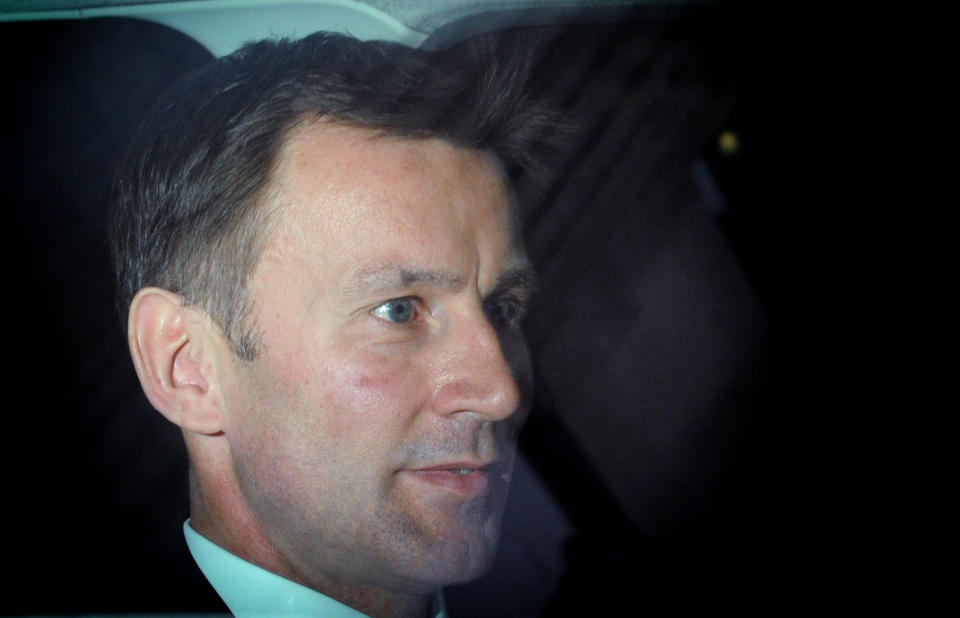 British Culture Secretary Jeremy Hunt leaves his office in central London for the House of Commons in Westminster , London Wednesday April 25 2012. Hunt is to make a statement to Parliament about his part in the News Corporation bid to take over BSkyB, after the release of a cache of emails yesterday sparked demands for his resignation. Speculation that Rupert Murdoch was seeking to inflict political pain on the Cameron's Conservatives mounted Tuesday when his son James gave damning testimony about British Olympics czar Jeremy Hunt, releasing documents which suggested that the Conservative minister had secretly smoothed the way for News Corp.'s proposed takeover of British Sky Broadcasting Group PLC. (AP Photo/Stefan Rousseau/PA Wire) UNITED KINGDOM OUT