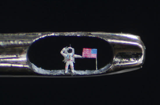 Apollo 11 moonwalker Buzz Aldrin is depicted in the eye of a needle, a work of art by sculptor, Willard Wigan.