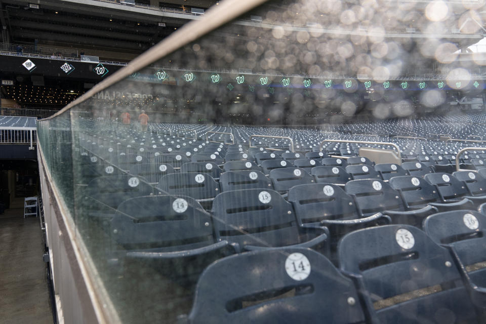 Fans exit the stands before a baseball game between the Washington Nationals and the San Francisco Giants at Nationals Park, Thursday, June 10, 2021, in Washington. The game was postponed until Saturday June 12th. (AP Photo/Alex Brandon)