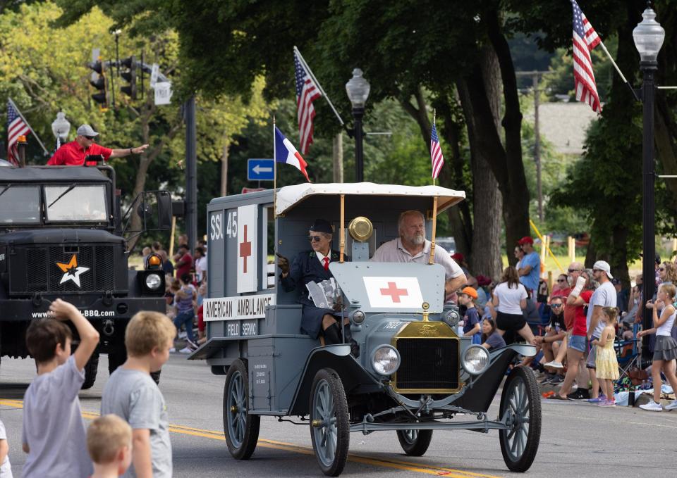 A vintage ambulance rolls down Main Street on Tuesday during the 52nd annual North Canton Fourth of July Parade.